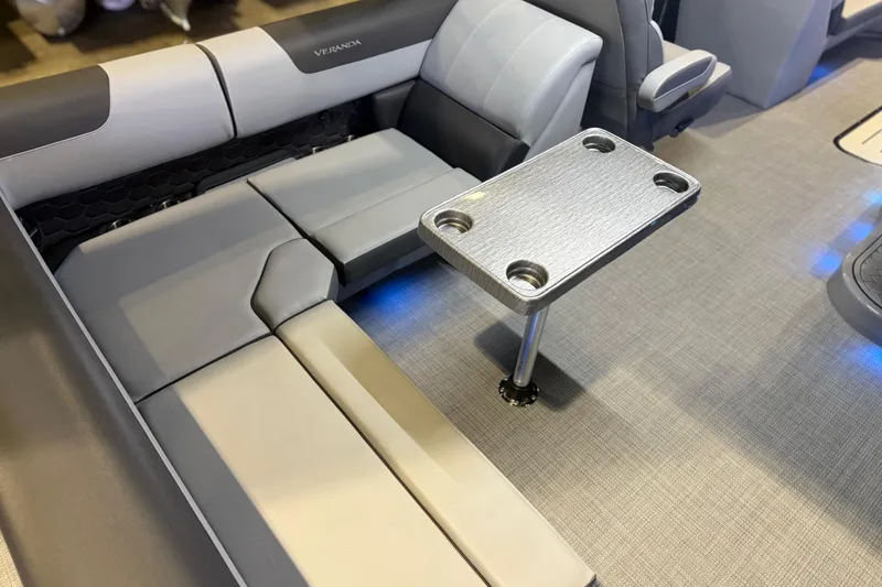 Slide: The Image of Luxurious seating and table setup on 2026 Veranda VR 235 L pontoon boat. - 10
