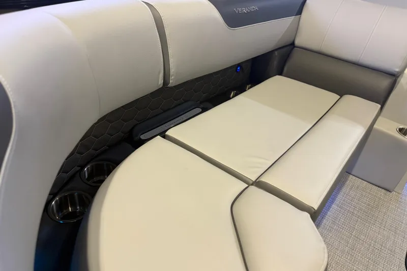 Slide: The Image of 2026 Veranda VR 235 L boat interior with luxurious seating and cup holders. - 2
