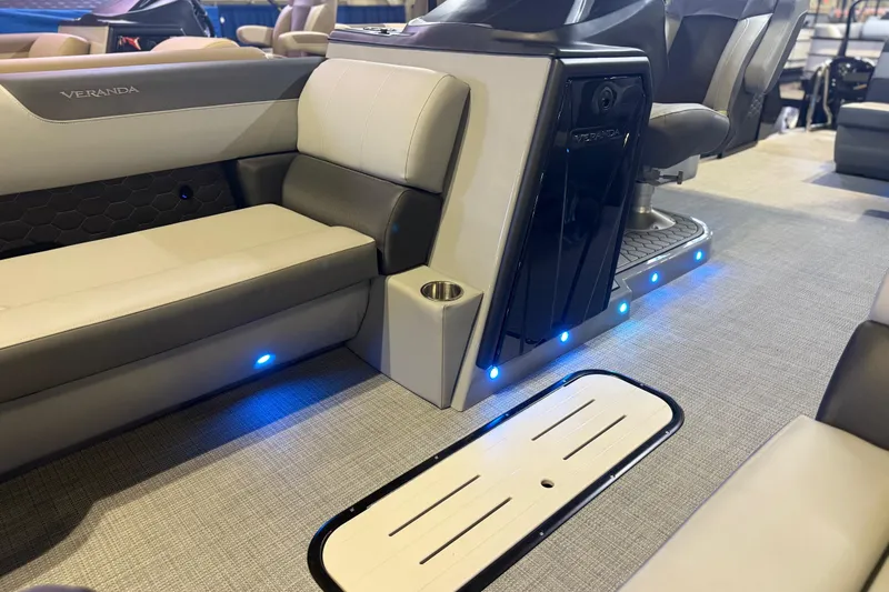 Slide: The Image of 2026 Veranda VR 235 L boat interior with modern seating and ambient blue lighting. - 3