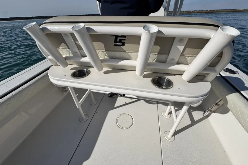 Slide: The Image of 2022 Carolina Skiff 24 Ultra Elite boat with rod holders and cup holders on deck. - 10