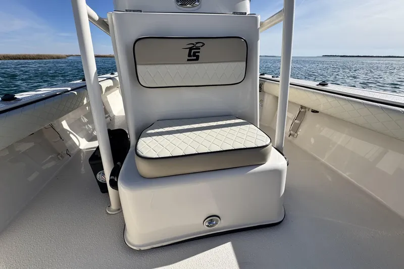 Slide: The Image of 2022 Carolina Skiff 24 Ultra Elite boat interior with cushioned seating. - 14