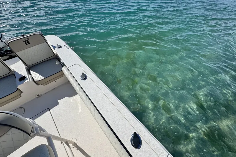 Slide: The Image of 2022 Carolina Skiff 24 Ultra Elite boat on clear blue water. - 18