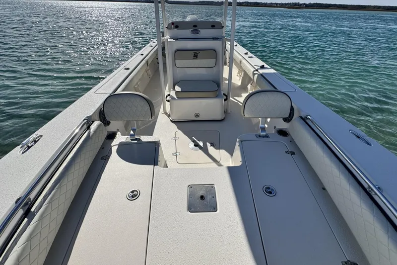 Slide: The Image of 2022 Carolina Skiff 24 Ultra Elite boat interior on calm water. - 22