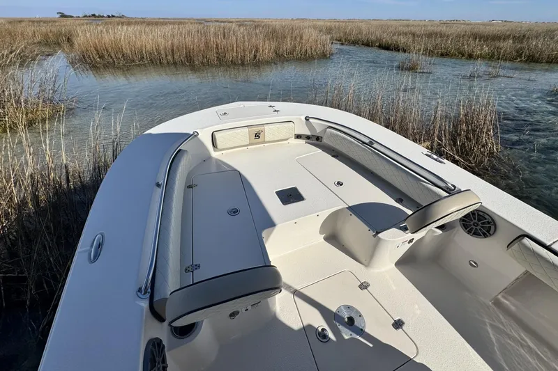 Slide: The Image of 2022 Carolina Skiff 24 Ultra Elite boat in marshland setting. - 23
