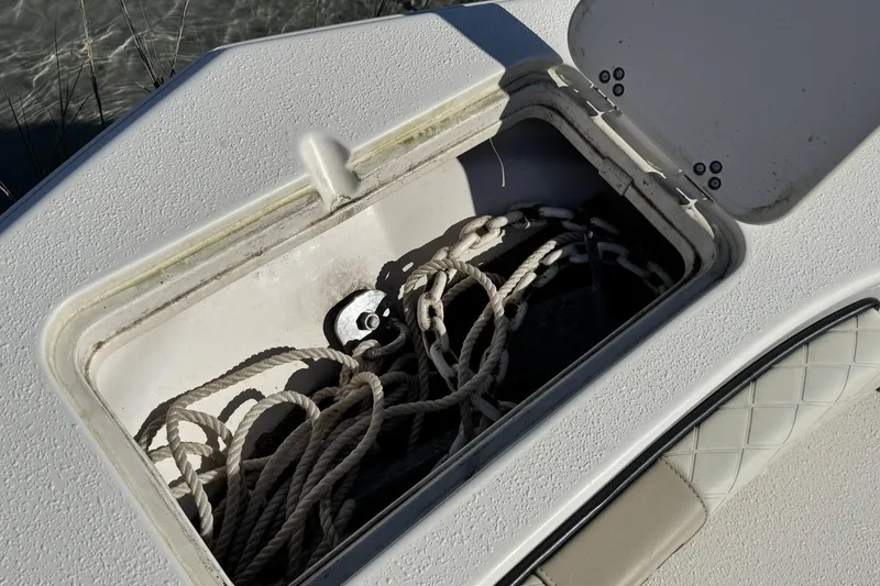 Slide: The Image of Storage compartment with ropes on a 2022 Carolina Skiff 24 Ultra Elite boat. - 39