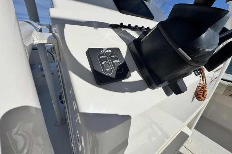 Slide: The Image of 2022 Carolina Skiff 24 Ultra Elite boat console with Lenco trim tab controls. - 4