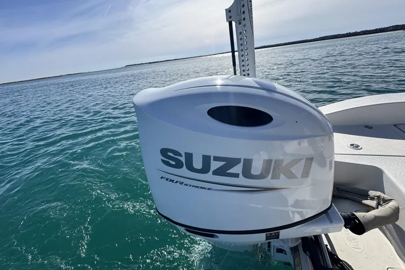 Slide: The Image of 2022 Carolina Skiff 24 Ultra Elite with Suzuki four-stroke engine on open water. - 40