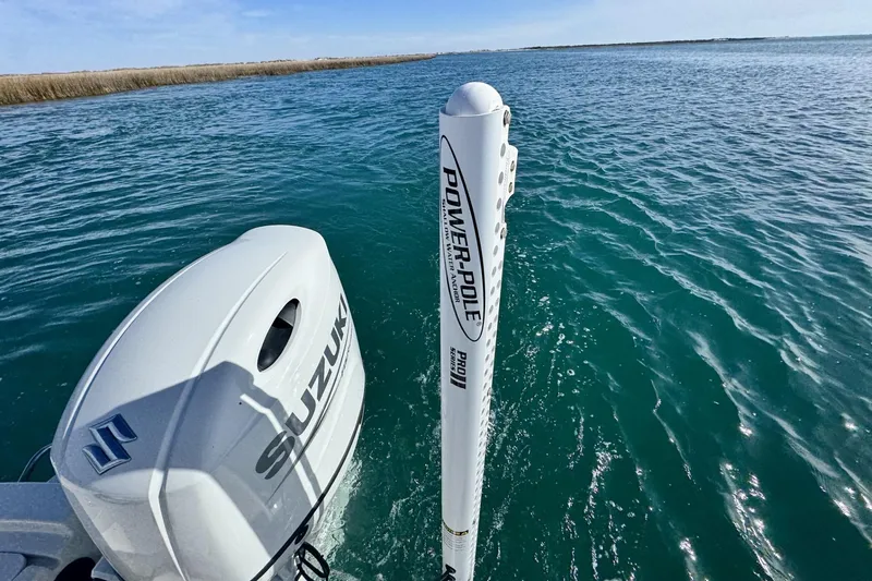 Slide: The Image of 2022 Carolina Skiff 24 Ultra Elite with Suzuki engine and Power-Pole in open water. - 41