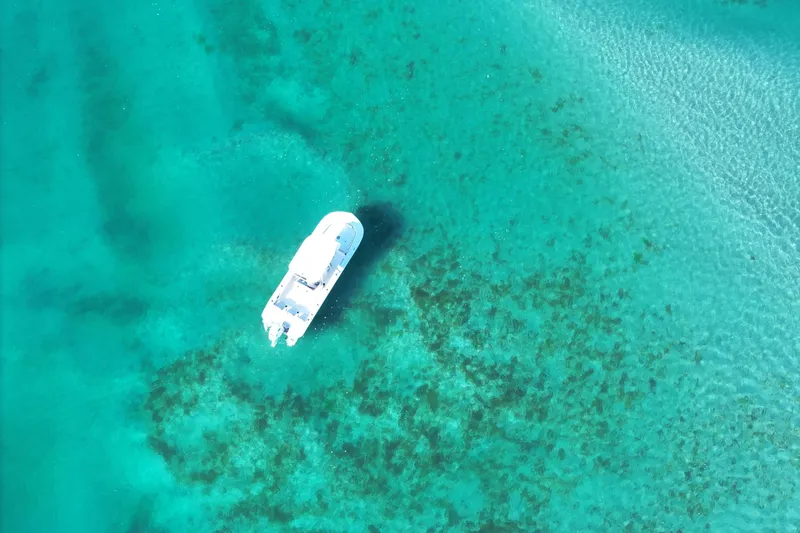 Slide: The Image of Aerial view of 2022 Carolina Skiff 24 Ultra Elite on clear turquoise water. - 43