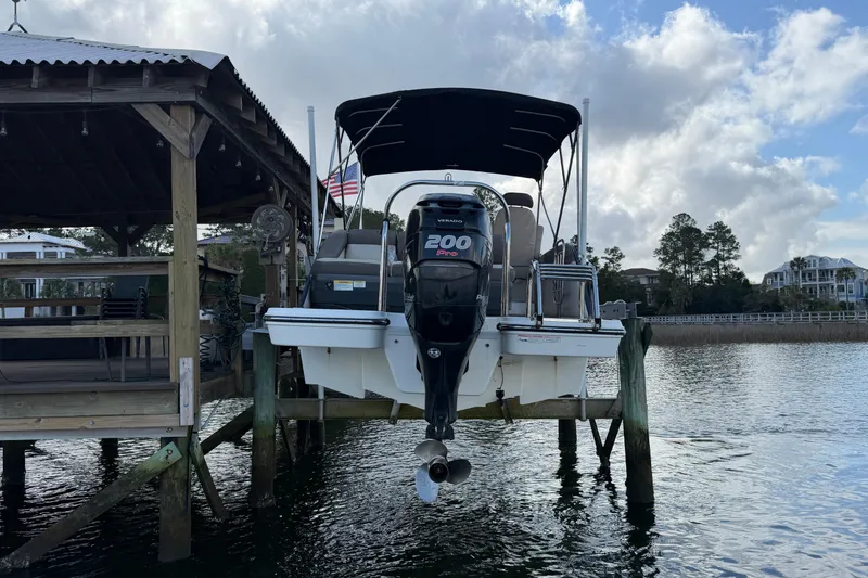 Slide: The Image of 2017 Bayliner Element XR7 boat docked with 200 Pro outboard motor. - 4