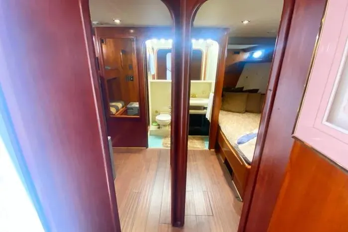 Slide: The Image of Interior of 1990 Viking Motor Yacht with wood paneling and cozy cabin. - 34
