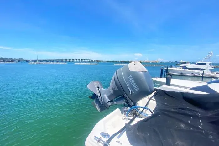 Slide: The Image of 1990 Viking Motor Yacht with Yamaha engine, docked by a scenic waterfront. - 73