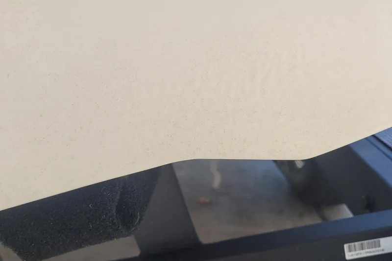 Slide: The Image of Close-up of 2024 Tahoe T21 boat hull with textured surface. - 12