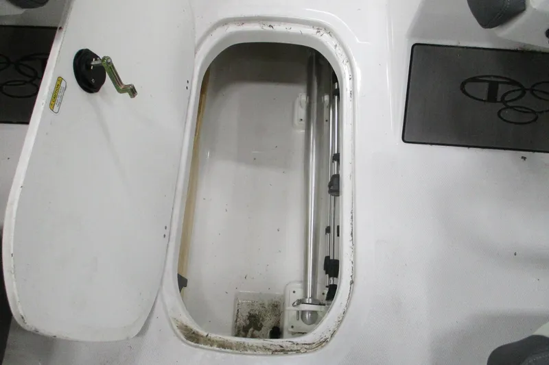 Slide: The Image of Open storage compartment in 2024 Tahoe T21 boat interior. - 26