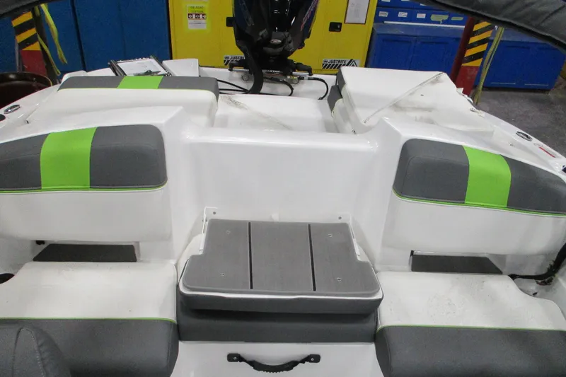 Slide: The Image of 2024 Tahoe T21 boat interior with gray and green seating, showcasing modern design. - 27