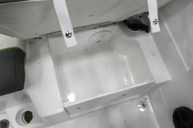 Slide: The Image of 2024 Tahoe T21 boat interior storage compartment with white straps and seating. - 4