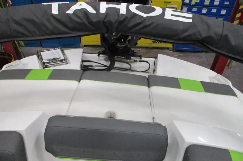 Slide: The Image of 2024 Tahoe T21 boat interior with gray and green seating, showcasing modern design. - 5