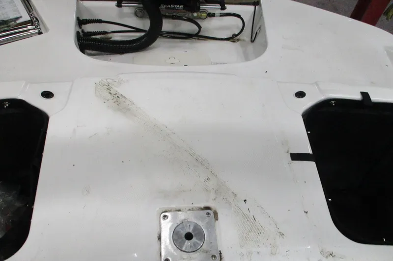 Slide: The Image of 2024 Tahoe T21 boat interior with visible wear and mechanical components. - 7