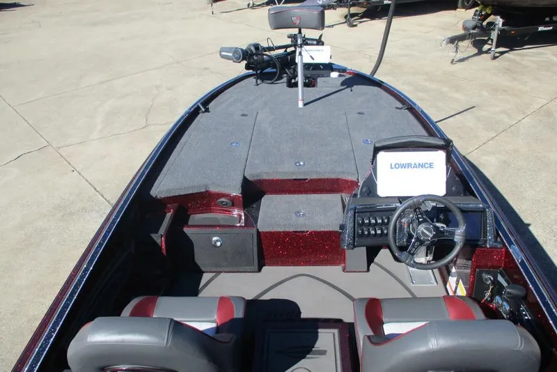 Slide: The Image of 2026 Triton 20XP Patriot boat interior with steering wheel and navigation system. - 4