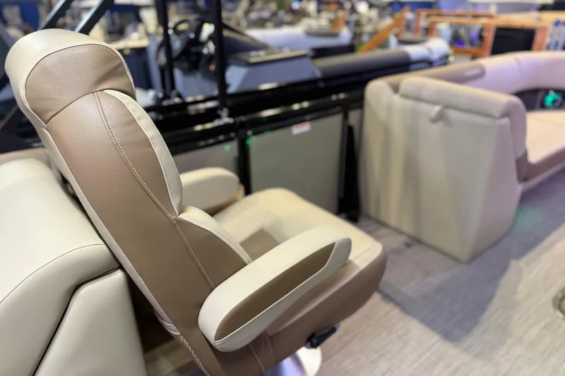 Slide: The Image of Luxurious seating on 2026 Veranda VR 235 RC pontoon boat, featuring beige and brown upholstery. - 14
