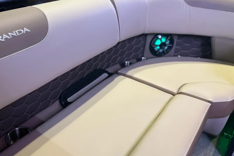 Slide: The Image of 2026 Veranda VR 235 RC boat interior with beige seating and illuminated speaker. - 4