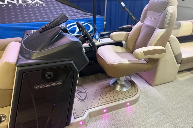 Slide: The Image of Luxurious Veranda VR 235 RC 2026 boat interior with plush captain's chair and sleek dashboard. - 6