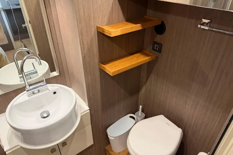 Slide: The Image of Bathroom interior of 2016 Cranchi Eco Trawler 53 Long Distance with sink and toilet. - 11