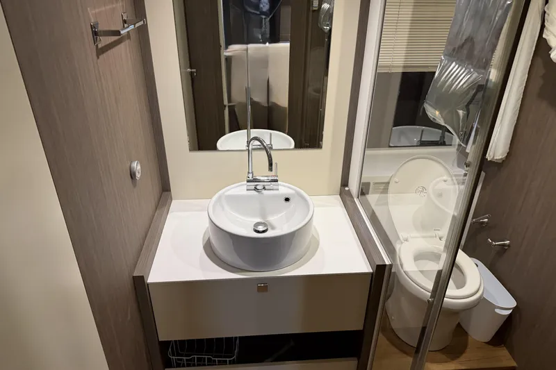 Slide: The Image of Bathroom interior of 2016 Cranchi Eco Trawler 53 Long Distance yacht, featuring modern sink and toilet. - 17