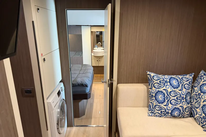 Slide: The Image of Interior of 2016 Cranchi Eco Trawler 53, featuring cozy seating and modern amenities. - 18