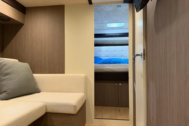 Slide: The Image of Interior of 2016 Cranchi Eco Trawler 53 Long Distance, featuring cozy seating and bedroom. - 19
