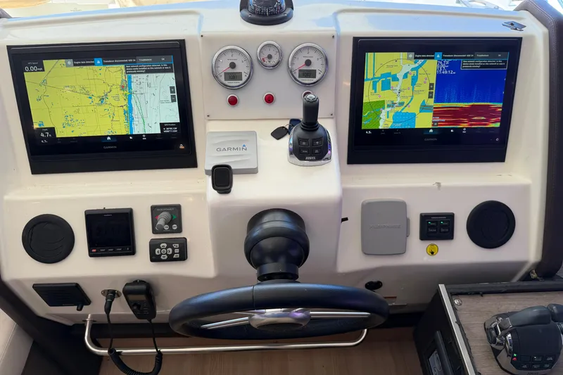 Slide: The Image of Cockpit of 2016 Cranchi Eco Trawler 53 with navigation screens and controls. - 23