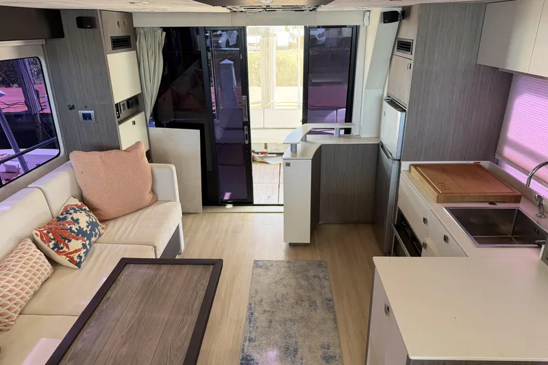 Slide: The Image of Interior of 2016 Cranchi Eco Trawler 53 Long Distance with modern kitchen and cozy seating area. - 25