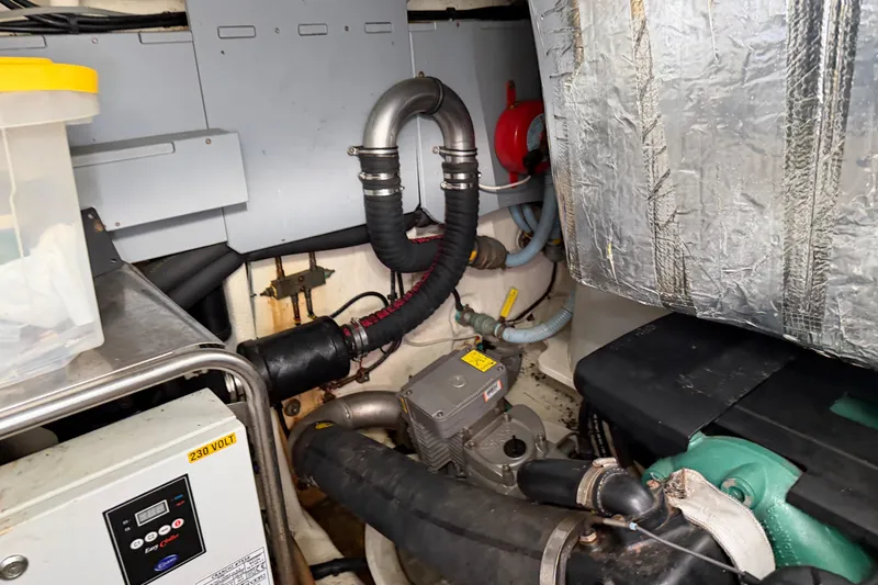 Slide: The Image of Engine room of 2016 Cranchi Eco Trawler 53 Long Distance, showcasing mechanical components. - 32