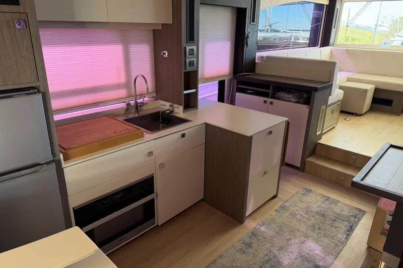 Slide: The Image of 2016 Cranchi Eco Trawler 53 Long Distance interior with modern kitchen and seating area. - 34