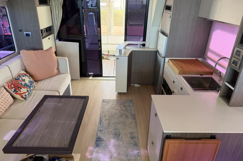 Slide: The Image of Modern interior of 2016 Cranchi Eco Trawler 53 Long Distance yacht with kitchen and seating area. - 7