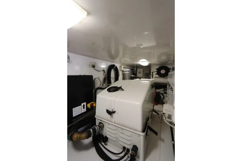 Slide: The Image of Engine room of 2011 Viking 46 Convertible yacht, featuring modern equipment and clean design. - 19