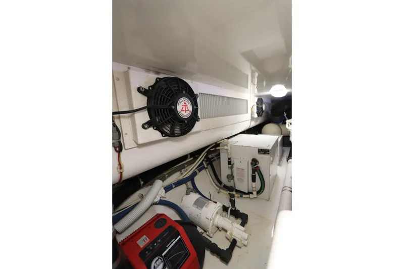 Slide: The Image of Engine room of 2011 Viking 46 Convertible yacht, featuring ventilation and mechanical systems. - 21