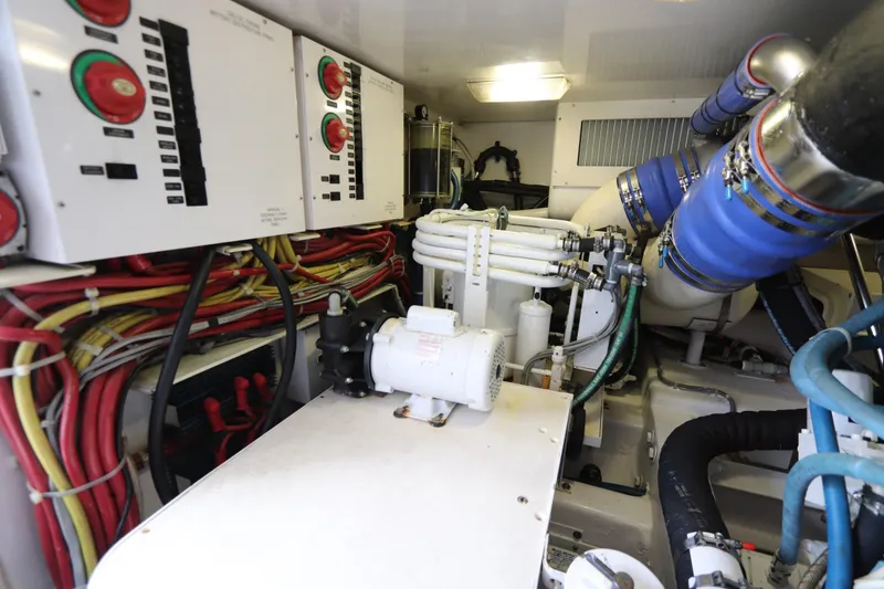 Slide: The Image of Engine room of 2011 Viking 46 Convertible yacht with wiring and machinery. - 23