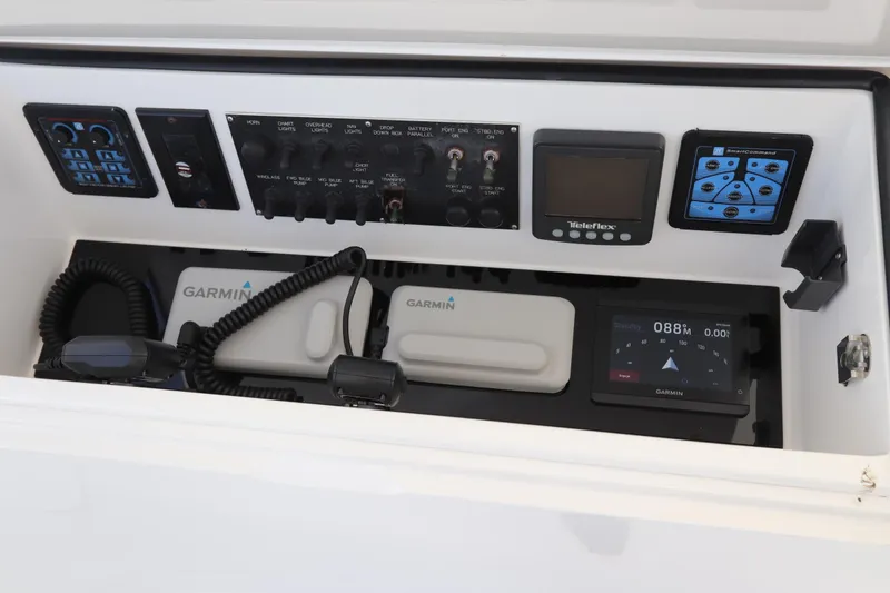 Slide: The Image of Control panel of a 2011 Viking 46 Convertible boat with Garmin navigation systems. - 30