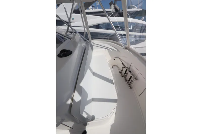 Slide: The Image of 2011 Viking 46 Convertible yacht deck with seating and ladder. - 31