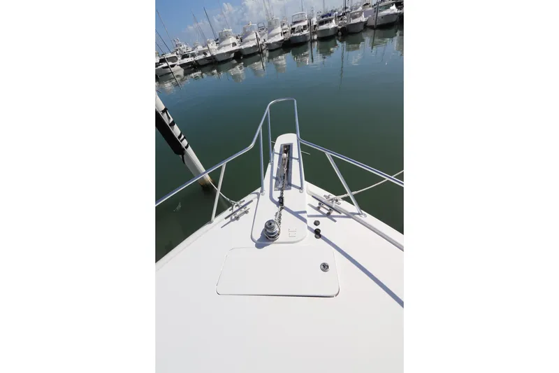 Slide: The Image of Bow view of 2011 Viking 46 Convertible yacht docked in marina. - 33