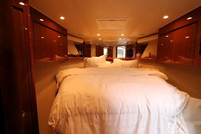 Slide: The Image of Luxurious bedroom interior of 2011 Viking 46 Convertible yacht with elegant wood finishes. - 6