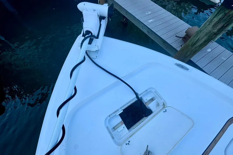 Slide: The Image of 2024 Sea Hunt BX 25 FS boat bow with trolling motor near dock. - 15