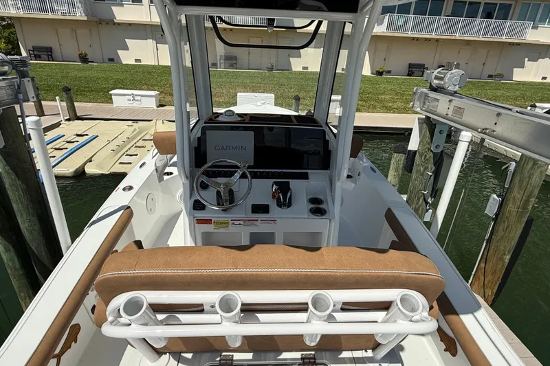 Slide: The Image of 2024 Sea Hunt BX 25 FS boat interior with Garmin navigation system at dock. - 20