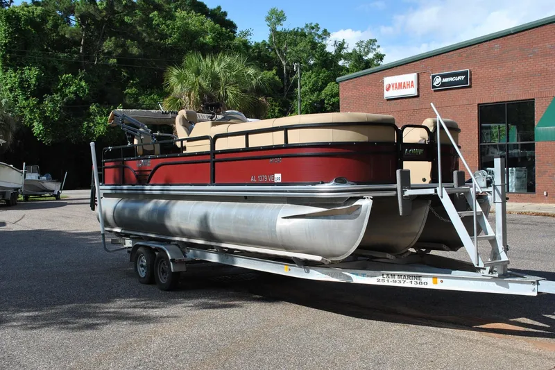 Slide: The Image of 2019 Lowe SF 232 Sport Fish pontoon boat on trailer, parked outside dealership. - 3