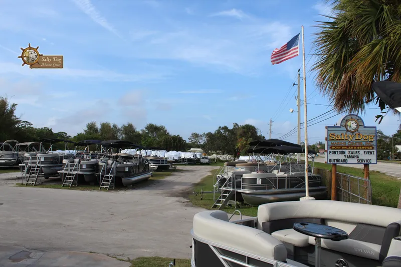 Slide: The Image of Boat dealership showcasing 2025 Sylvan MIRAGE 820 PARTY FISH 4.0 pontoon boats. - 24