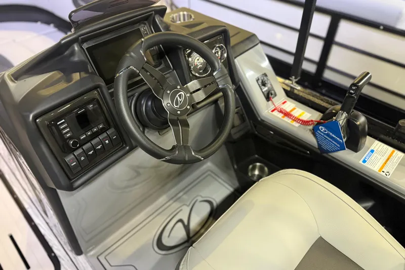 Slide: The Image of 2026 Veranda Relax VR22RC boat dashboard with steering wheel and control panel. - 5