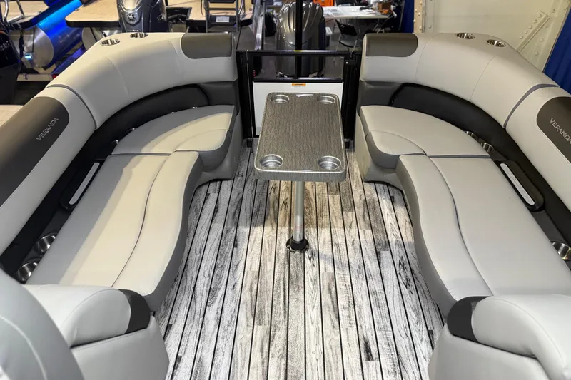 Slide: The Image of 2026 Veranda Relax VR22RC boat interior with stylish seating and table on wood-patterned flooring. - 6