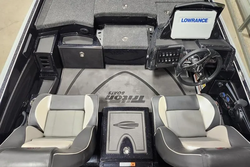 Slide: The Image of 2026 Triton 21XP Patriot boat interior with dual seats and Lowrance electronics. - 10