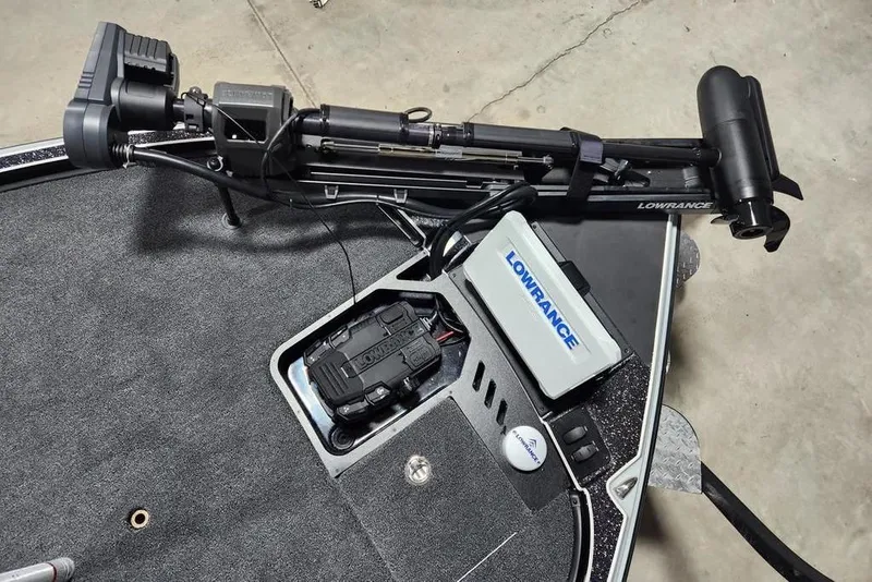 Slide: The Image of Triton 21XP Patriot 2026 boat with Lowrance trolling motor and electronics on deck. - 6